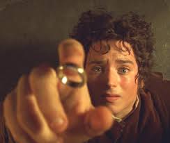 Frodo Baggins (Elijah Wood) and the ring he must bear.