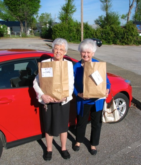 Mom, right, and Charlotte make their Meals on Wheels run Easter morn.